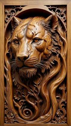 an intricate carved wood panel with a lion's head in the center and leaves around it