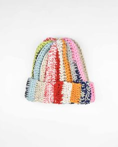 multicolored knitted hat on white background