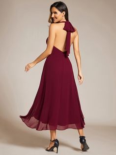 the back of a woman wearing a wine colored dress