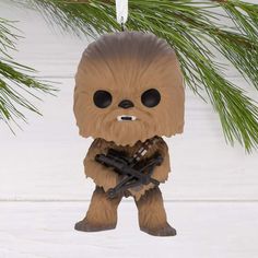 Relive the excitement of your favorite Star Wars adventures with this Christmas tree ornament of Han Solo's loyal and brave co-pilot, Chewbacca. The mighty Wookiee warrior holds his bowcaster. The decoration features signature styling that resembles a scaled-down version of one of your favorite Funko POP! designs. Additional Details: Resin ornament features hanger attachment. Includes: One Hallmark Christmas ornament. Approx. Size in Inches: 2 x 3.5 x 2.25 Wookiee Warrior, Star Wars Funko Pop, Custom Card Box, Kids Milestones, Christmas Board Games, Jim Shore Christmas, Willow Tree Figurines, Hallmark Christmas Ornaments, Stocking Stuffers For Kids