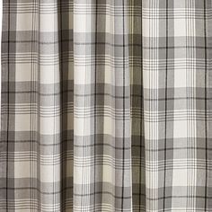 the curtain is open and has a checkered pattern on it's fabric,