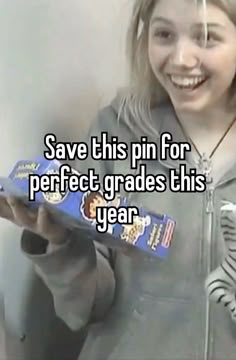 a girl holding a box with some candy in it and the caption says save this pin for perfect grade this year