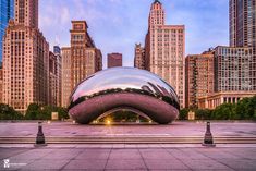 a large shiny object sitting in the middle of a city