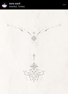 an image of the back side of a white paper with black and silver designs on it