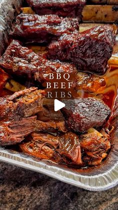 bbq beef ribs with barbecue sauce on the side