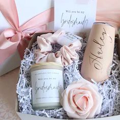 an open box with candles, flowers and cards