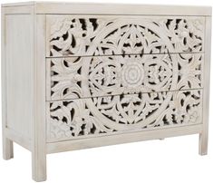 an ornate white chest with carvings on the front and sides, against a white background