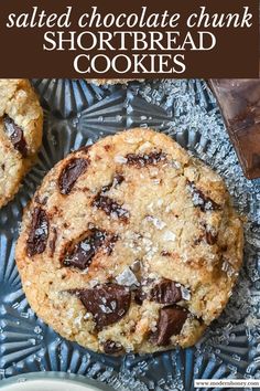 salted chocolate chunk shortbread cookies on a plate with text overlay that reads salted chocolate chunk shortbread cookies