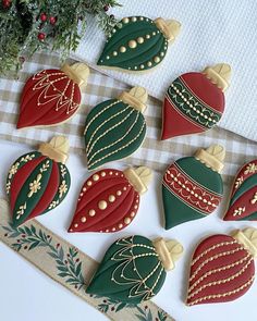 decorated christmas cookies are arranged on a table