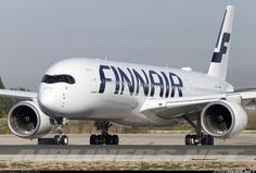 a finnair airplane on the tarmac at an airport