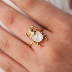 This beautiful ring is made in Sterling Silver and coated with a thick layer of 24K Yellow Gold to a Gold Vermeil thickness and set with a natural Moonstone. 24K Gold Vermeil jewelry is not only hypoallergenic, but it also does not tarnish.  Your ring is meticulously handcrafted and hand-polished to perfection. It is made to last a lifetime with proper care. This is a unique piece of minimalist jewelry for everyday wear.  Please note: Due to the one-of-a-kind nature of the gemstone, exact colors The Bling Ring, Animal Ring, Ear Climbers Earrings, Wearable Art Jewelry, Accessory Ideas, Ear Cuff Earings, Funky Jewelry, Labradorite Ring