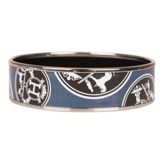 This bracelet is in printed enamel with silver plated hardware. This style depicts a different printed logos on a blue background. Origin: France Condition: Preloved - Mint. The bracelet has no visible signs of wear on the enamel. The hardware rim is shiny with very minor surface scratches. Accompanied by: Hermes box, dustbag Size: PM (65) Measurements: Diameter: 2.5"; Width: .75" Prada Jewelry, Ysl Shoes, Mint Blue, Dior Shoes, Louis Vuitton Shoes