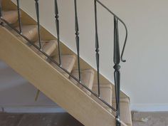 the stairs are made of wood and have metal handrails