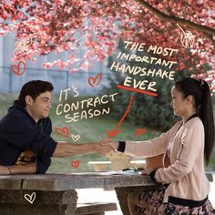 a man and woman sitting at a picnic table shaking hands with the words, the most important handshake ever it's contact season