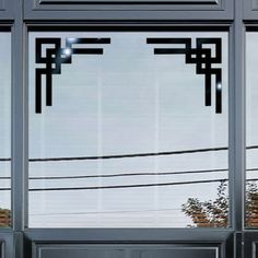 the reflection of power lines in the windows of an office building's front door