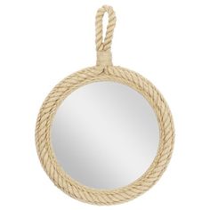 a round rope mirror hanging on a white wall with a circular mirror in the middle