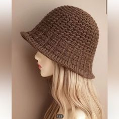 a mannequin head wearing a brown knitted hat