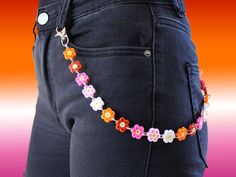 ⚠️ NOTICE: some colors may vary from the pictures.  Set of decorative jeans chain of flowers made by Hama with a representative color of each Pride flag and a pair of earrings done with colored beads and combinable with the chain. All these articles are done by hand, resistant, suitable for Pride month, and very unique!  ✧･ﾟ:* This article can be sold separately 🌼 DIMENSIONS 🌼 Chain length: 51 cm (20,0787 inches) Flowers of the Chain: 22 Earrings length: 4 cm - 4,3 cm (1,5748 inches - 1,69291 inches) Beads of the pair of earrings: 10 - 12 🌙 MATERIALS 🌙 The flowers are made by Hama, known as Perler beads too. Each flower is linked by a stainless steel packing ring. In the two chain ends, there is a carabiner for hooking the chain to the jeans, made of stainless steel. The earrings are d Lesbian Accessories, Pride 2024, Chain Of Flowers, Chain Jeans, Jeans Chain, Pride Jewelry, Pants Chain, Pant Chains, Pride Jewellery