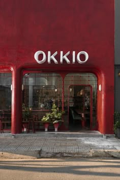 a red building with the word okko on it's front door and windows