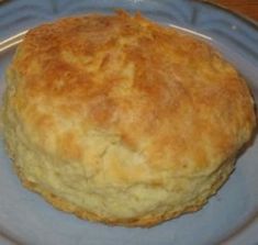 a close up of a bread on a plate with a fork in the middle of it