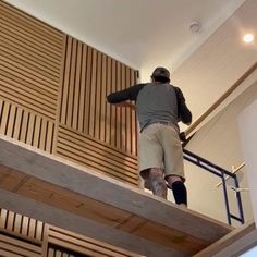 a man is climbing up the stairs with his skateboard