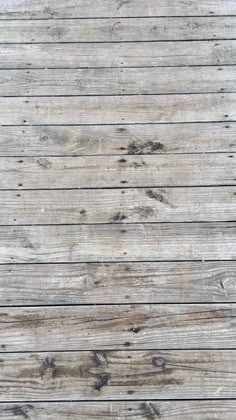 an old wooden floor with planks that have been stained white