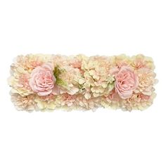 pink and white flowers are arranged on the side of a headband with green leaves