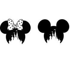 mickey and minnie mouse ears are shown in black and white with the silhouettes of buildings behind them