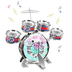 a toy drum set with musical notes coming out of it