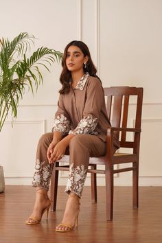 PRODUCT DETAIL: Introducing our "Blossom Brown Embroidered Co-ord Set" – a testament to grace and sophistication. This ensemble features a rich brown linen fabric adorned with exquisite white floral embroidery that adorns the collar, sleeves, and pant borders, adding a touch of timeless charm. Delicate pintex detailing Cord Sets Formal, Linen Co Ord Sets Women, Embroidery Co Ord Set, Coord Sets For Women 2024, Pakistani Co Ord Sets, Code Set Dress, Linen Coord Set, Velvet Co Ord Set, Co-ord Sets