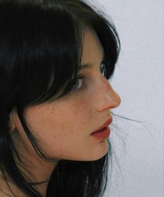 a close up of a woman with black hair