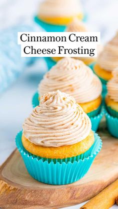 cupcakes with frosting and cinnamon sticks on a cutting board