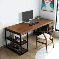 a wooden desk with a computer monitor and keyboard sitting on top of it next to a window