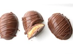 three pieces of chocolate with peanut butter in the middle and one piece cut out to look like an egg