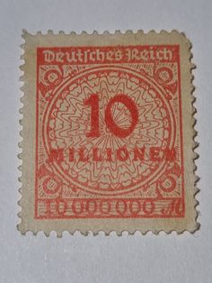 an old red and white stamp with the number 10 on it's front side