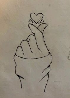 a drawing of a hand with a heart on it's finger and the word love written below