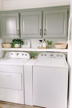 a white washer and dryer sitting in a kitchen next to eachother