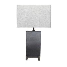 a black table lamp with a white shade on it's base and a square light bulb