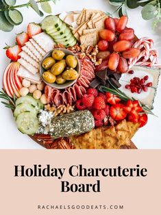 the holiday charcuterie board is full of fruits, vegetables and crackers to enjoy