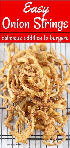 onion rings on a cooling rack with the title easy onion strings delicious addition to burgers