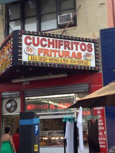 the sign for cuchiritos frituras is lit up