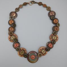 a necklace with various buttons on it