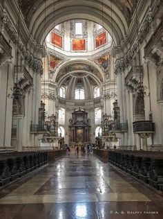 the inside of an old church with pews