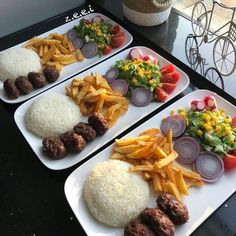 three plates filled with different types of food