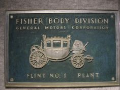 a sign that says fisher body division general motors corporation flint no 1 plant