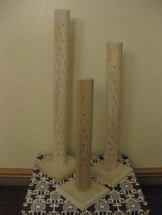 two wooden candlesticks sitting on top of a table