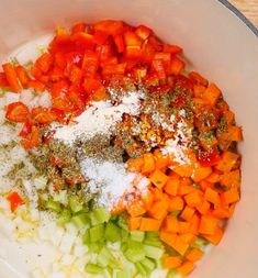 chopped carrots, onions and seasoning in a bowl