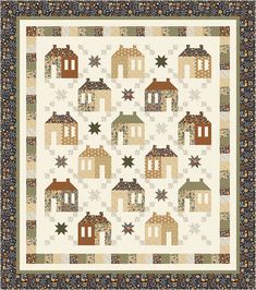 a quilt with houses and stars on it