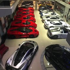 a room filled with lots of different colored cars