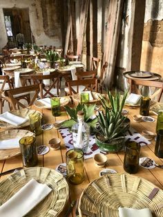 the table is set with plates and glasses